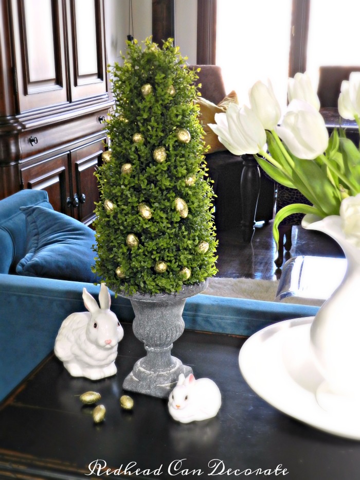 How cute & easy is this Easter Egg Boxwood Topiary! She used dollar store eggs and the topiaries are pretty affordable and can be used for many seasons and occasions.