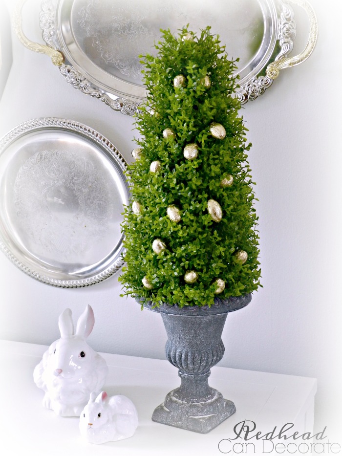 How cute & easy is this Easter Egg Boxwood Topiary! She used dollar store eggs and the topiaries are pretty affordable and can be used for many seasons and occasions.
