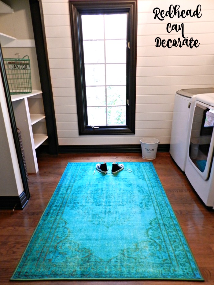 This vintage turquoise rug in this laundry room makeover is so gorgeous!