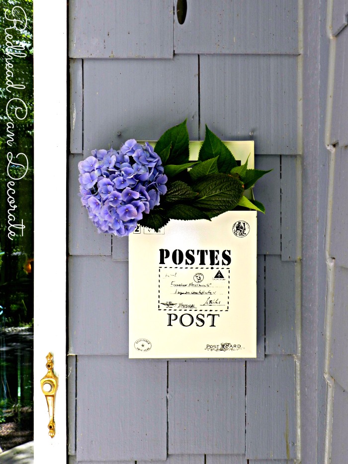 What a cute vintage style mailbox to hang by your door even if you don't need one there. She fills hers with flowers!