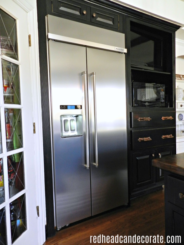 What a beautiful built-in-refrigerator transformation. This 1994 old Sub-Zero refrigerator is replaced with a modern classic kitchen aid stainless steel side by side refrigerator.