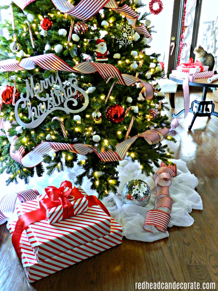 This Cotton Candy Cane Christmas Tree is so clever and cute! She used cotton balls for snowballs and the dollar store star floats above the tree! 
