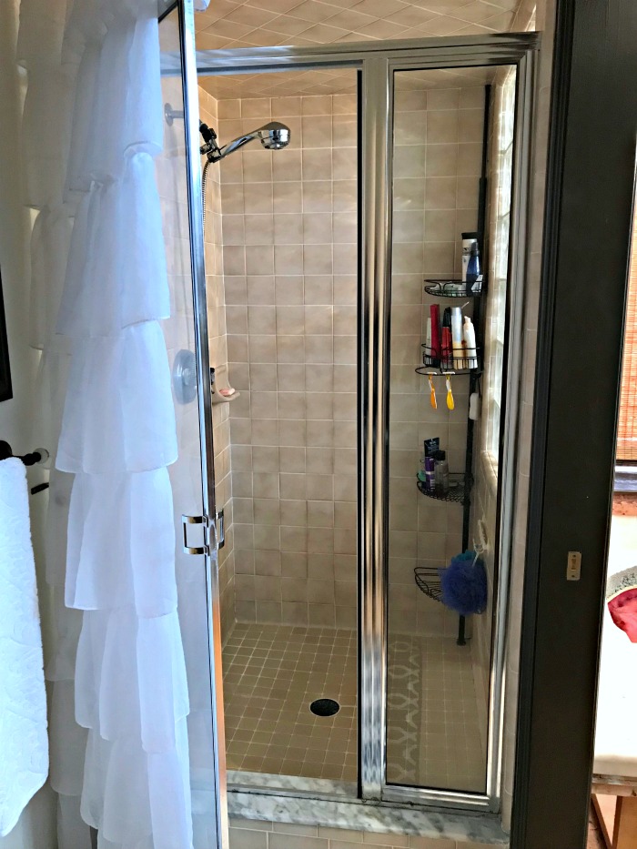 BEFORE PHOTO: A Michigan couple transformed their bathroom with this beautiful Master Bathroom Renovation Shower Reveal!