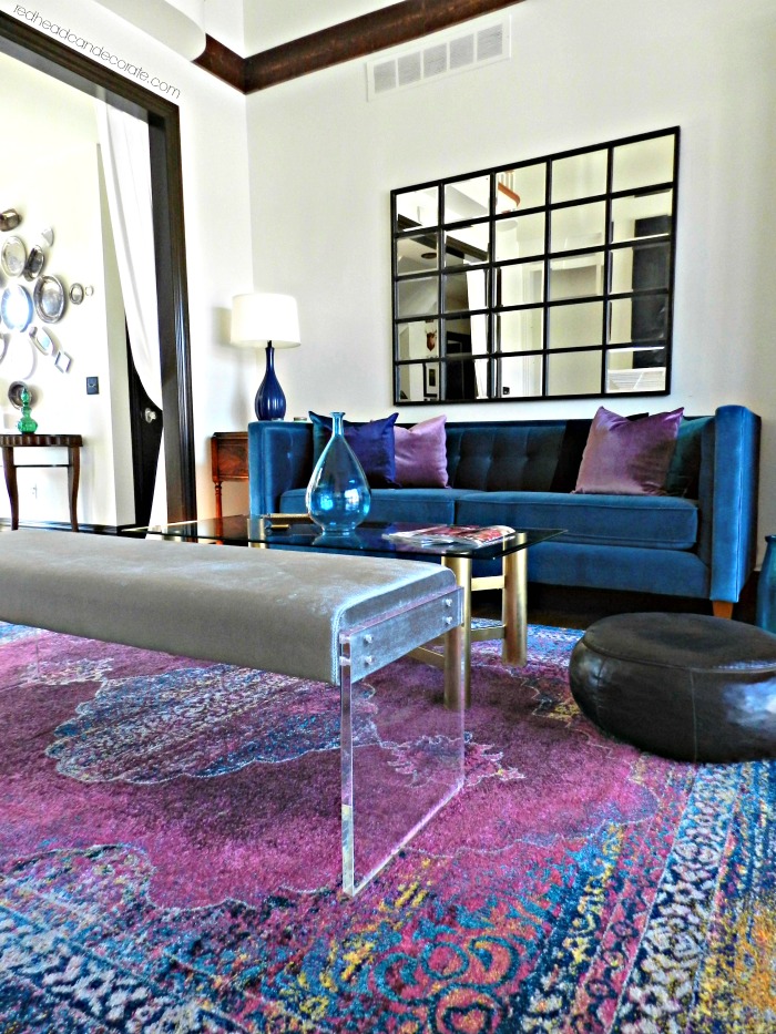 Transform Your Living Room with Vibrant Colors such as pink, purple, and blue! The pillow and rug sources are all listed.