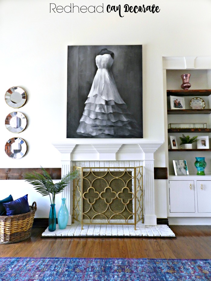 This Painted Built-In Shelves & Brick Fireplace makeover is truly shocking!