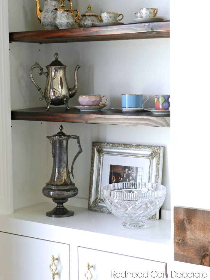 This Painted Built-In Shelves & Brick Fireplace makeover is truly shocking!