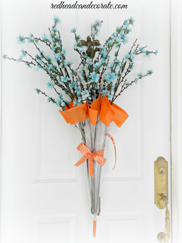 The Garden Glove Spring Wreath is so cute and only cost $11 dollars to make with dollar store supplies!