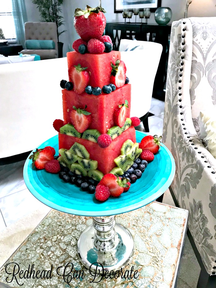 This DIY watermelon cake is made easily with seedless watermelons and fresh berries and kiwi.  There is a full tutorial and more fantastic photos!