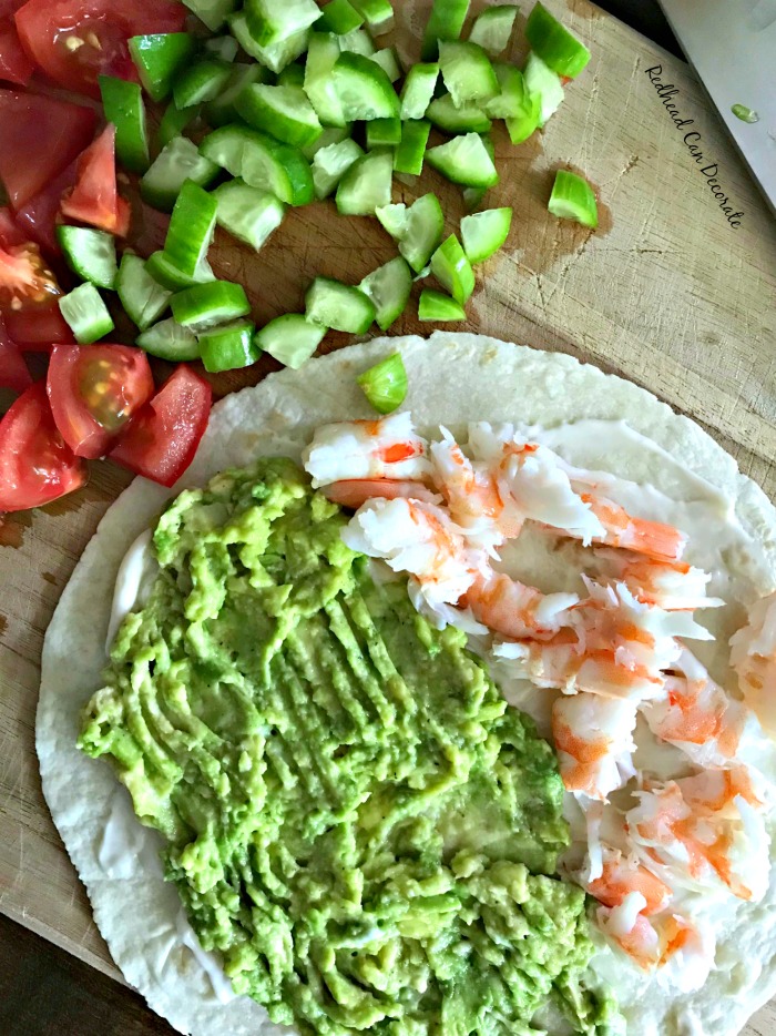 Don't let this healthy looking Avocado Shrimp Wrap fool you...it's not only good for you, but it's packed with protein, flavor, and low on calories.  It is extremely satisfying for lunch!
