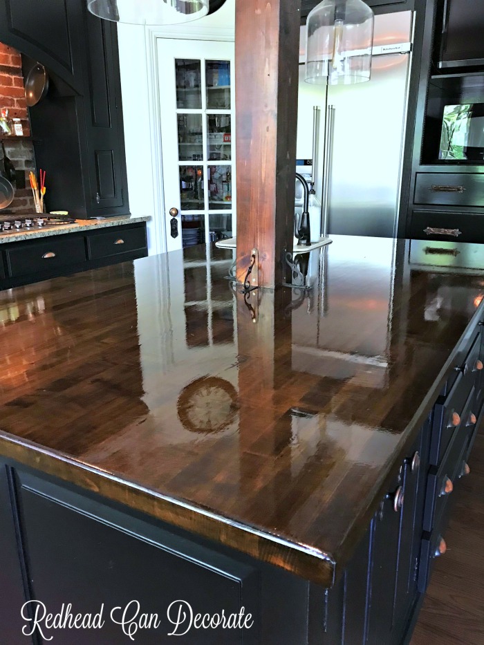 This DIY Refinished Butcher Block Kitchen Island is absolutely gorgeous, and she shares the products she used!