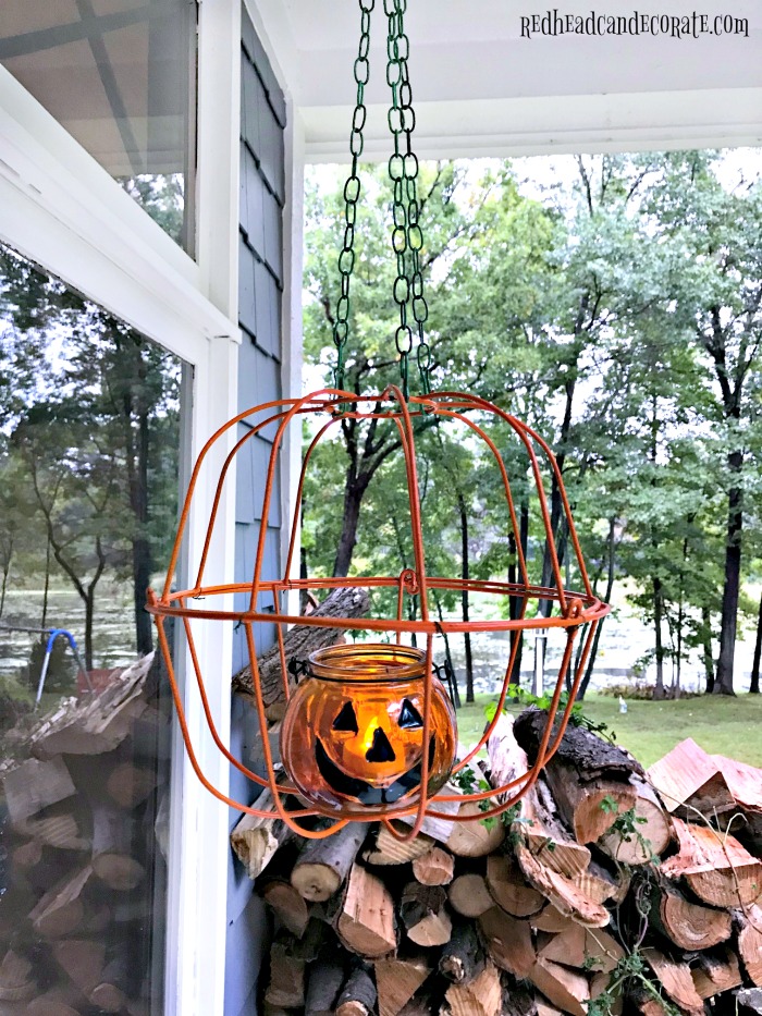 This Dollar Store Hanging Jack-O'-Lantern would look so cute on a porch or lined up on a sidewalk!