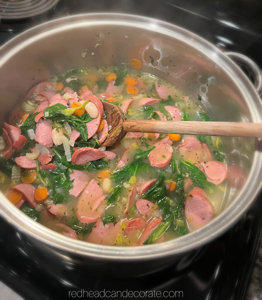 Redhead's Simple Sausage, Spinach & Bean Soup is packed with savory sausage, hearty veggies, and whips up in just a couple minutes.  Serve over rice, pasta, or even pierogi.